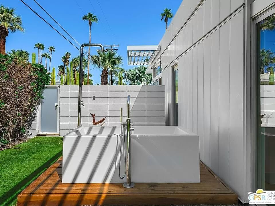 Outdoor Bathing Oasis with Sleek Modern Tub and Privacy Walls