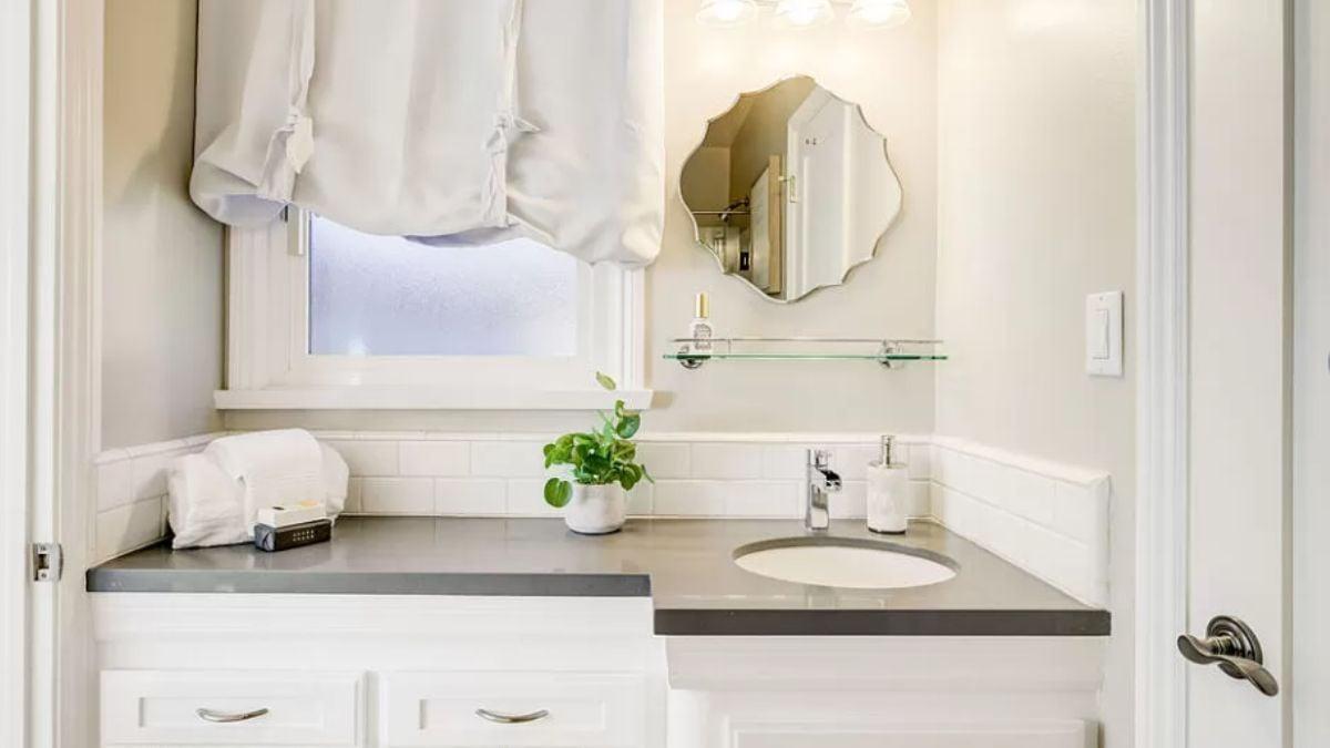 Chic Bathroom Vanity Featuring an Artful Mirror