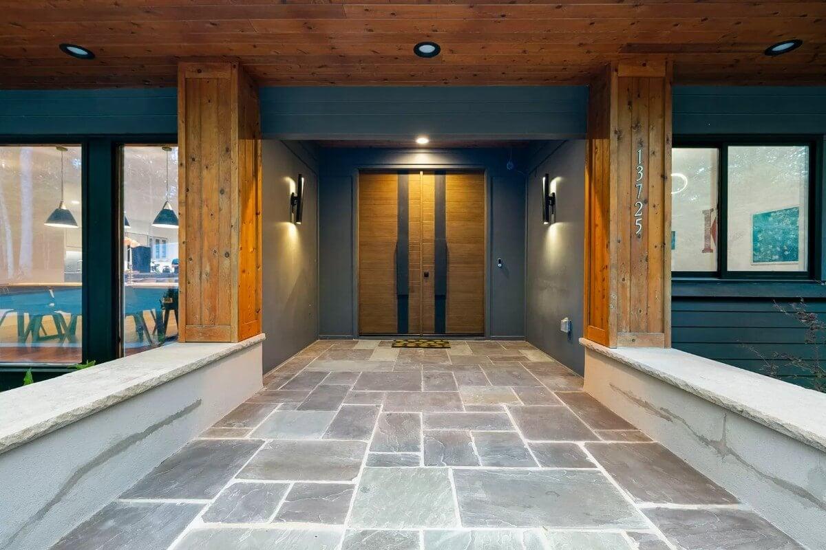 Broad Entryway with Natural Wood Accents and Reflective Lighting