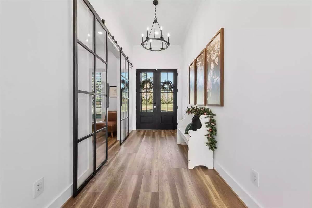Industrial Chic Entryway with Striking Black Steel Doors
