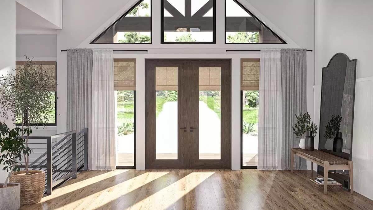 Bright Entryway with Expansive Glass Doors and Architectural Beam Accents