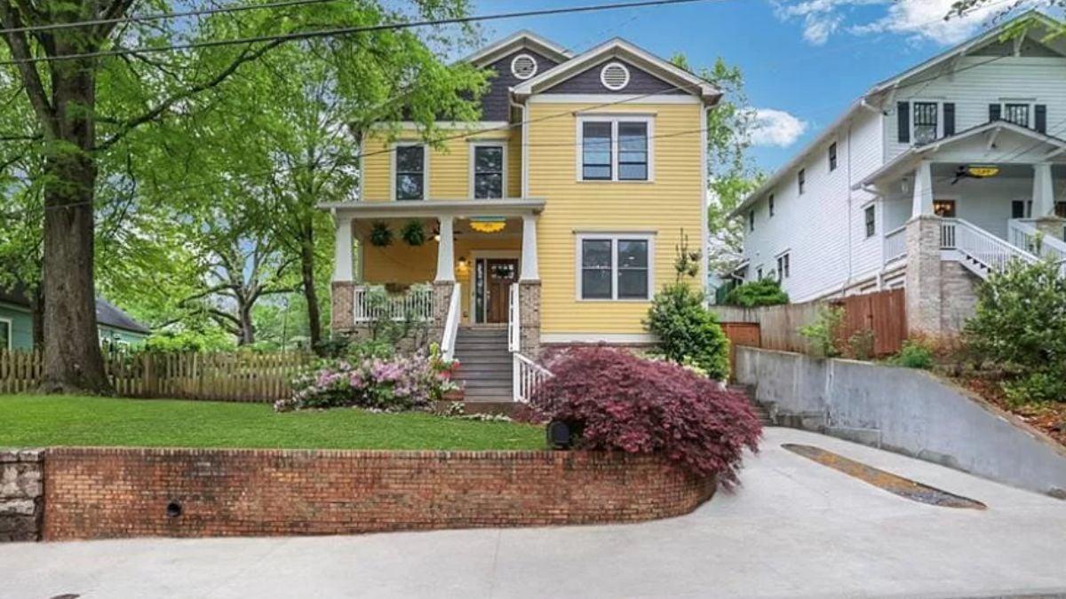 Classic Craftsman Style with a Cheerful Yellow Facade and Inviting Front Porch