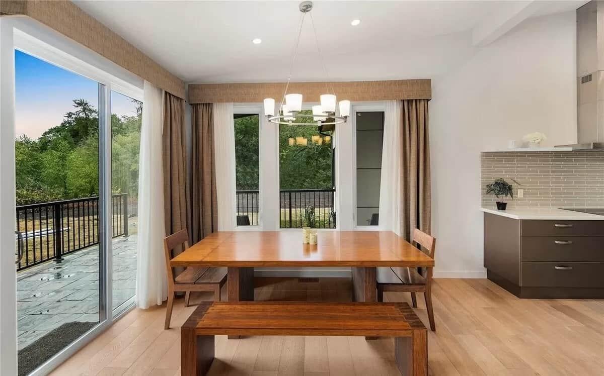 Notice the Chic Pendant Light Over This Minimalist Dining Setup
