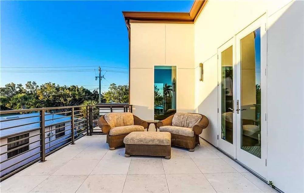 Enjoy the Sunset: Contemporary Balcony with Cozy Seating