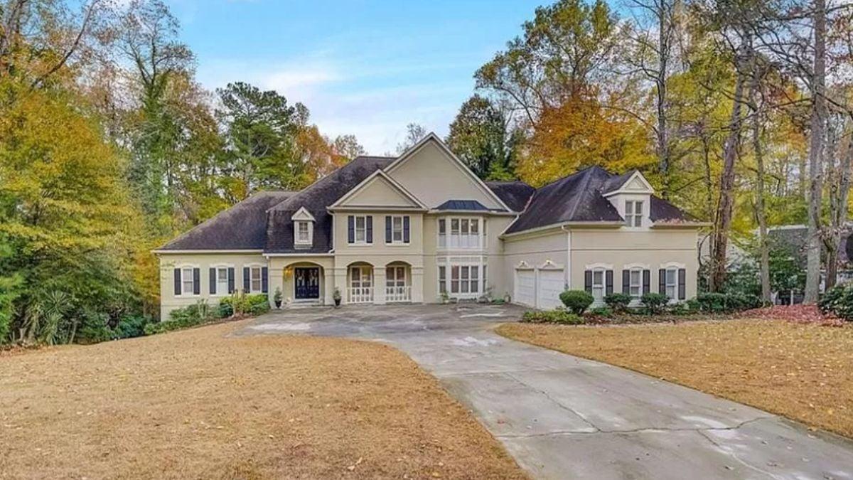 Elegant Home with Grand Double Doors and Thoughtful Landscaping