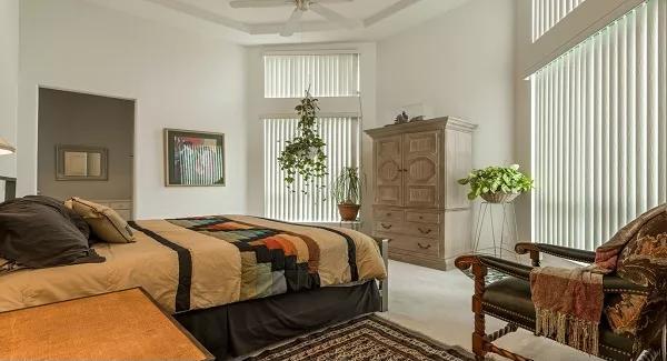Notice the Soaring Ceilings in This Sunlit Bedroom Retreat