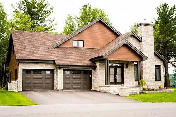 Craftsman-Style Home with Striking Stone and Wood Facade