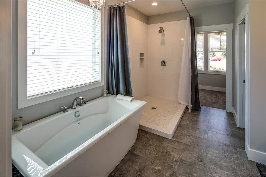 Notice the Freestanding Tub Complementing the Minimalist Shower