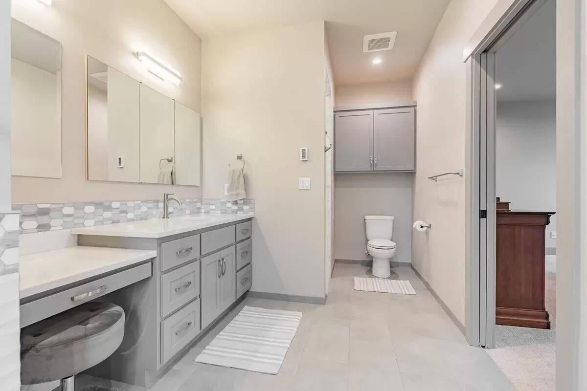 Sleek Gray Vanity with a Dash of Hexagonal Tiles