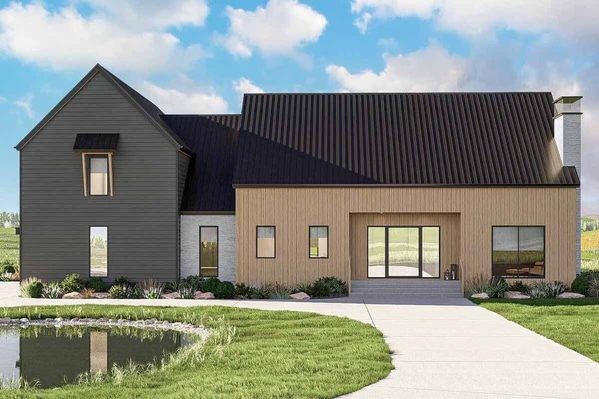 Modern Farmhouse with Striking Black Roof and Reflective Pond