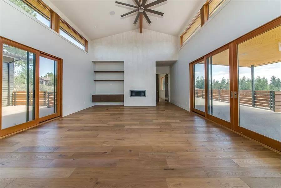 Catch the Airiness of This Vaulted Living Room with Expansive Glass Doors