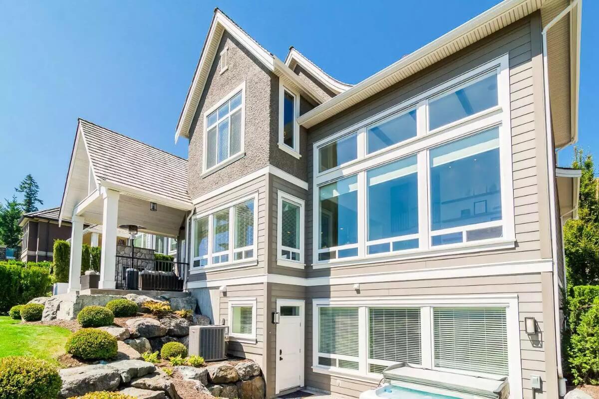 Large Panoramic Windows and Well-Manicured Landscaping