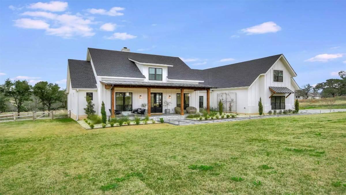 Admire the Charming Farmhouse Facade with its Inviting Porch