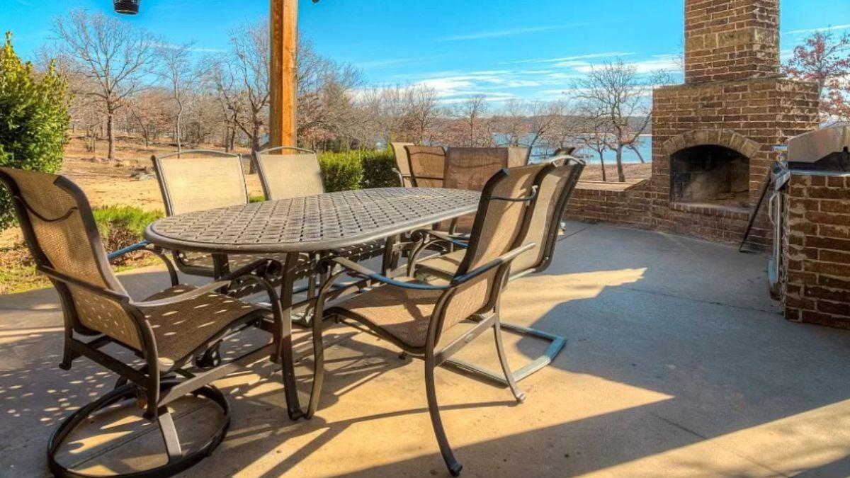 Check Out the Brick Fireplace and Lake Views on This Patio