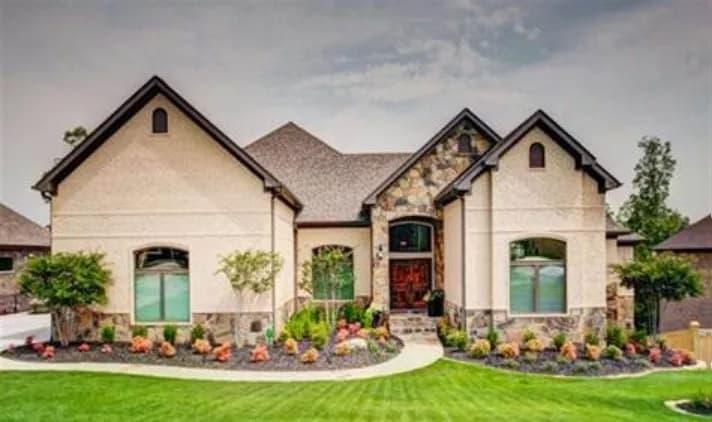 Elegant Facade with Stone Accents and a Grand Entrance