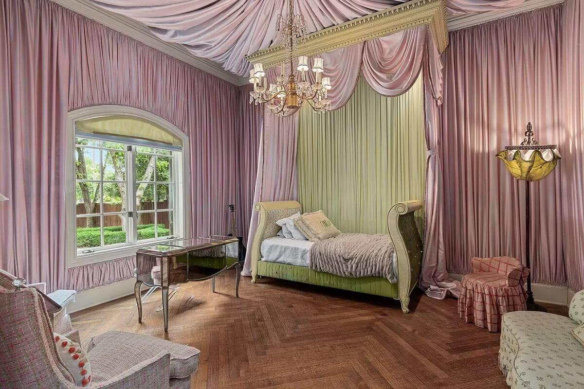 Luxurious Bedroom with Draped Ceiling and a Sleigh Bed
