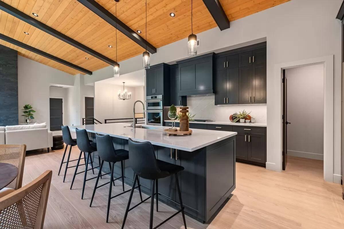 Marvel at the Striking Dark Cabinetry and Inviting Island Seating