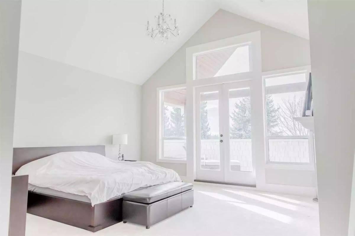 Vaulted Ceiling Bedroom with a Private Balcony