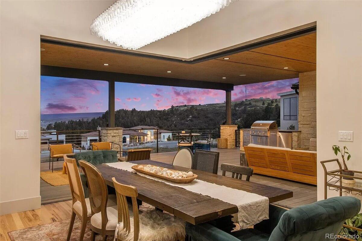 Warm Dining Setting Opens to Spectacular Patio Views