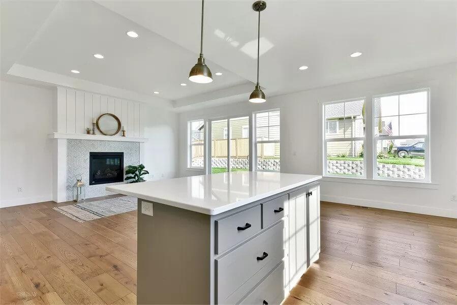 Wide-Open Living Area Featuring a Cozy Fireplace and Shiplap Detail