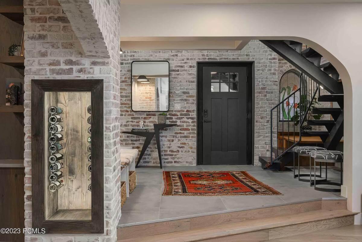 Intriguing Industrial Meets Rustic in This Entryway—Love the Watch Display!