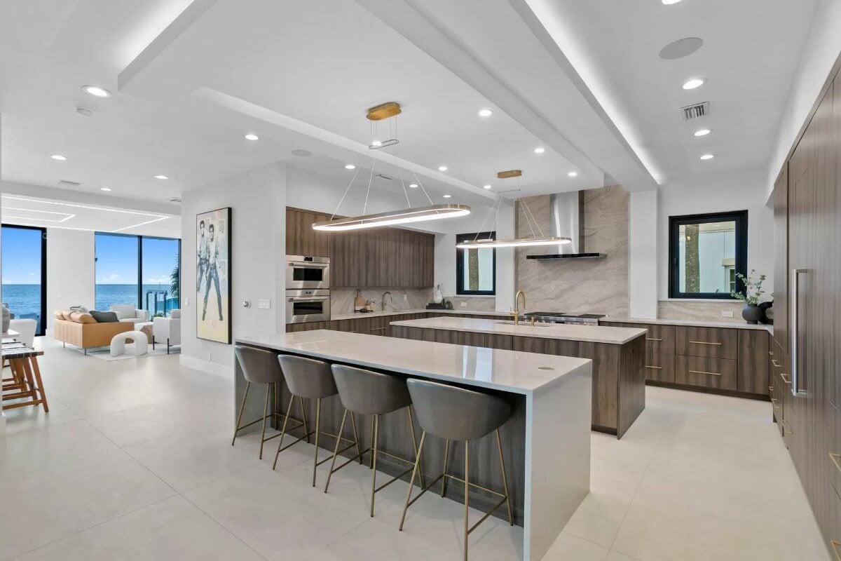 Gourmet Kitchen with a Striking Waterfall Island and Ocean Views