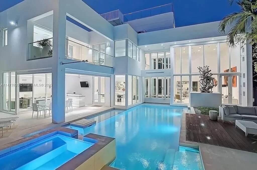 Modern Poolside Oasis with Expansive Glass Walls