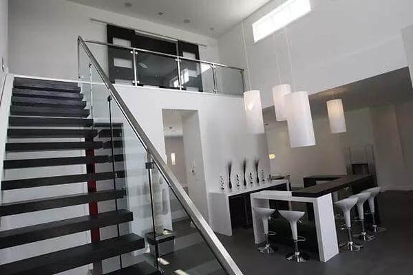 Striking Staircase and Pendant Lights Transform This Minimalist Space