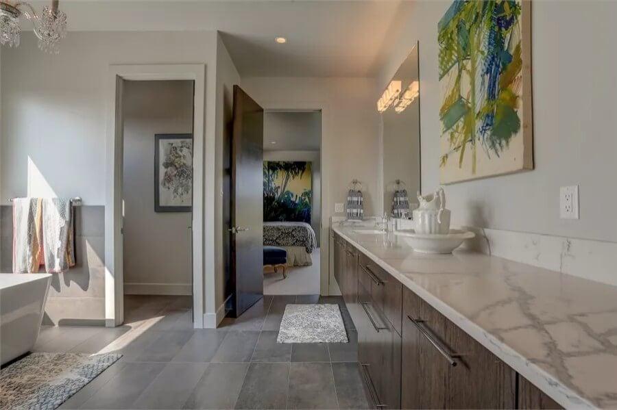 Elegantly Minimalistic Bathroom with a Burst of Colorful Art