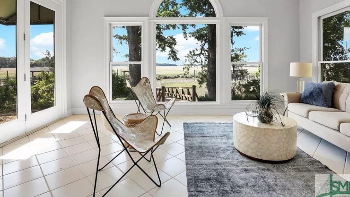 Sunroom Delight with Butterfly Chairs and Picture Windows