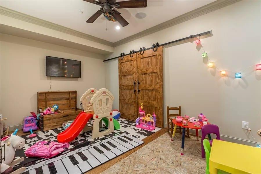 Fun Playroom Centered Around a Piano Key Rug and Barn Door Charm