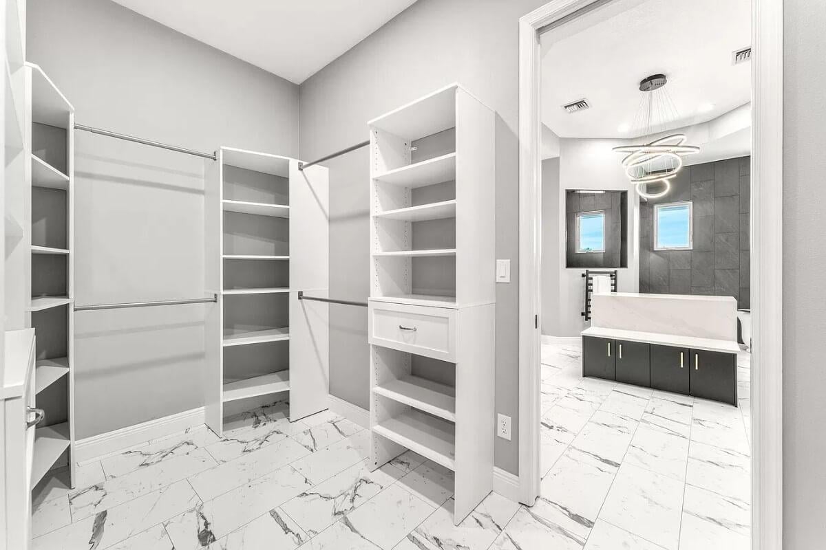 Step Into This Organized Walk-In Closet with Sleek White Shelving
