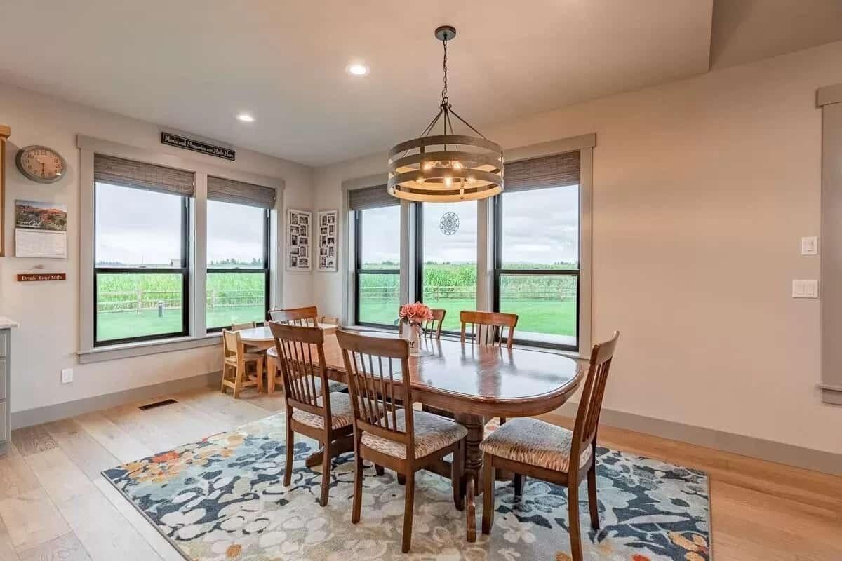 Warm Dining Nook with Farmhouse Table and Oversized Windows