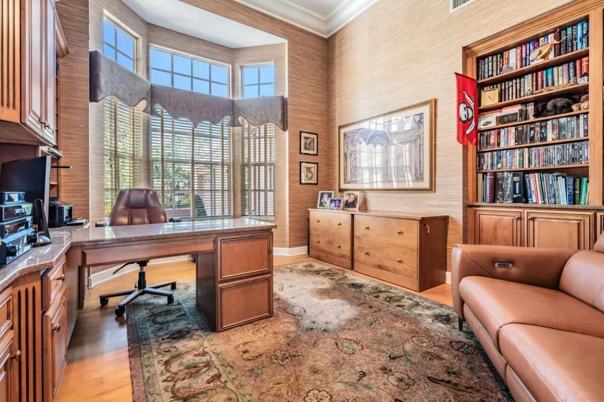 Elegant Home Office with Rich Wooden Bookcase and Bay Window