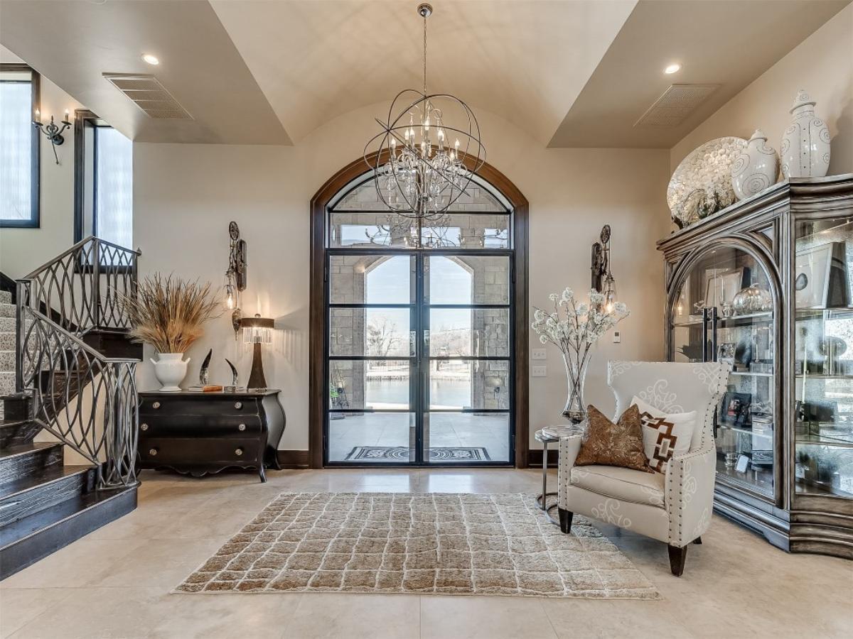 Grand Entryway with an Ornate Iron Staircase That