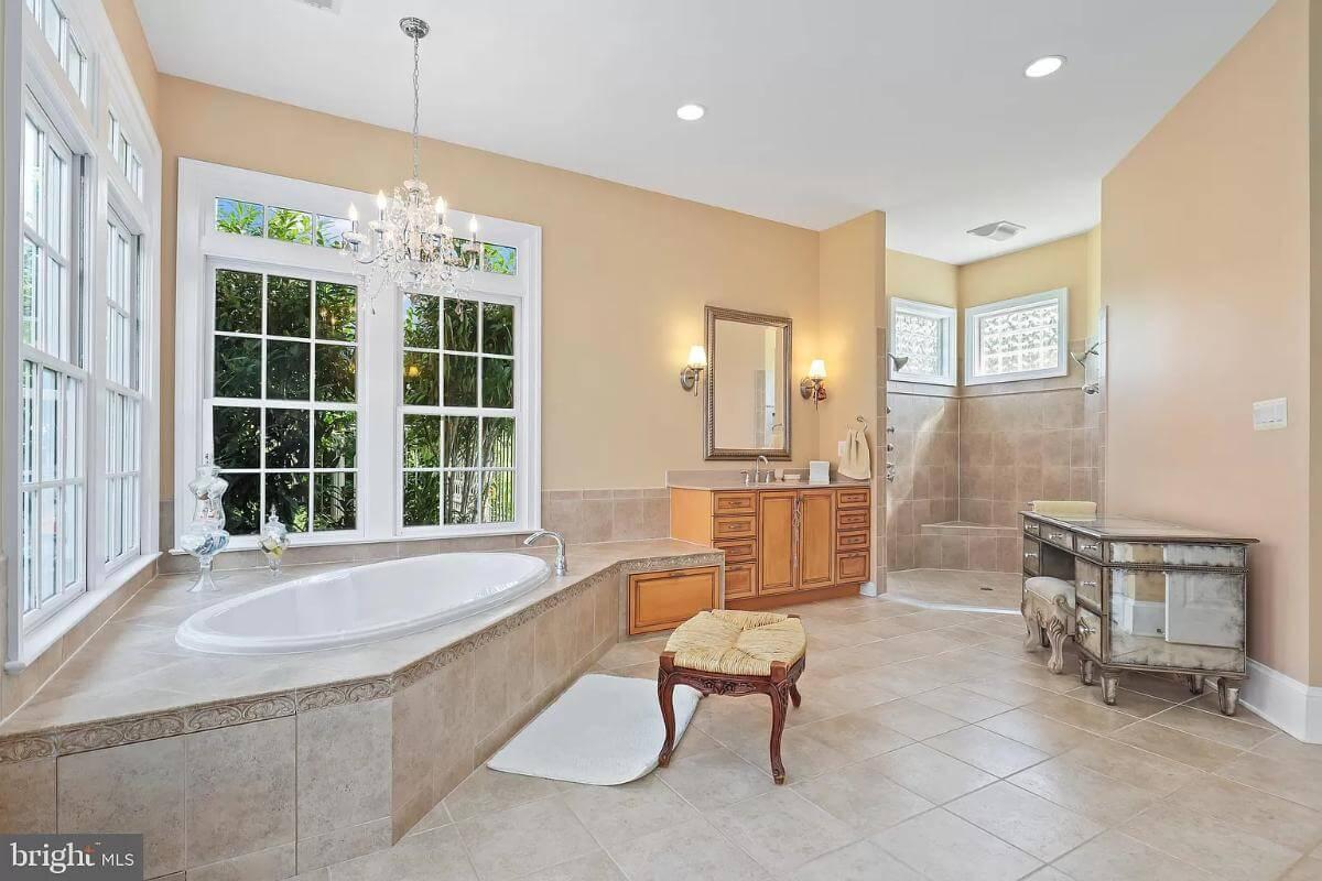 Luxurious Bathroom Design with a Captivating Chandelier Above the Tub
