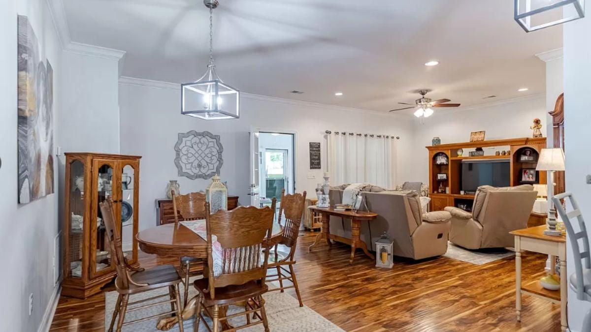 Open-Concept Living Area with a Distinctive Glass Pendant Fixture