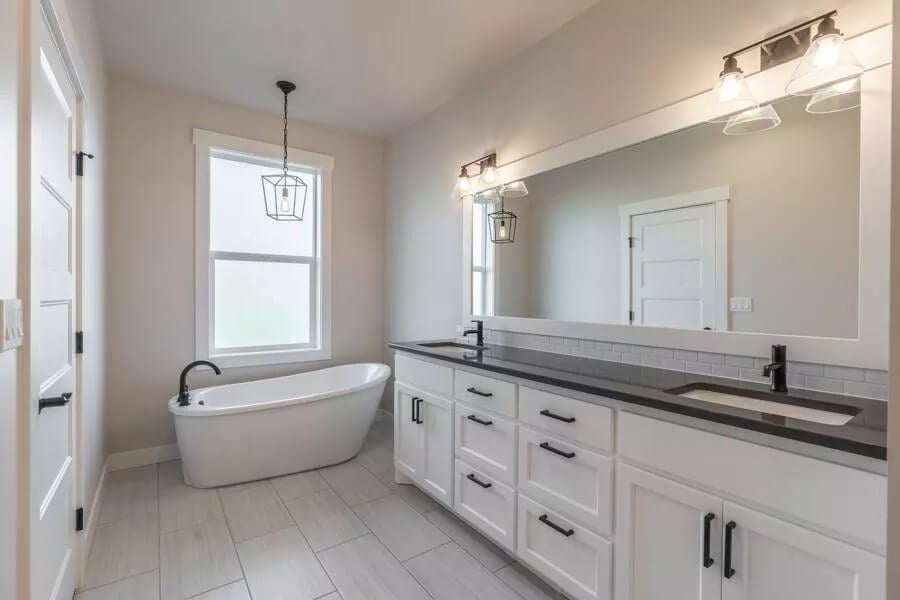 Notice the Freestanding Tub in This Clean and Bright Craftsman Bathroom