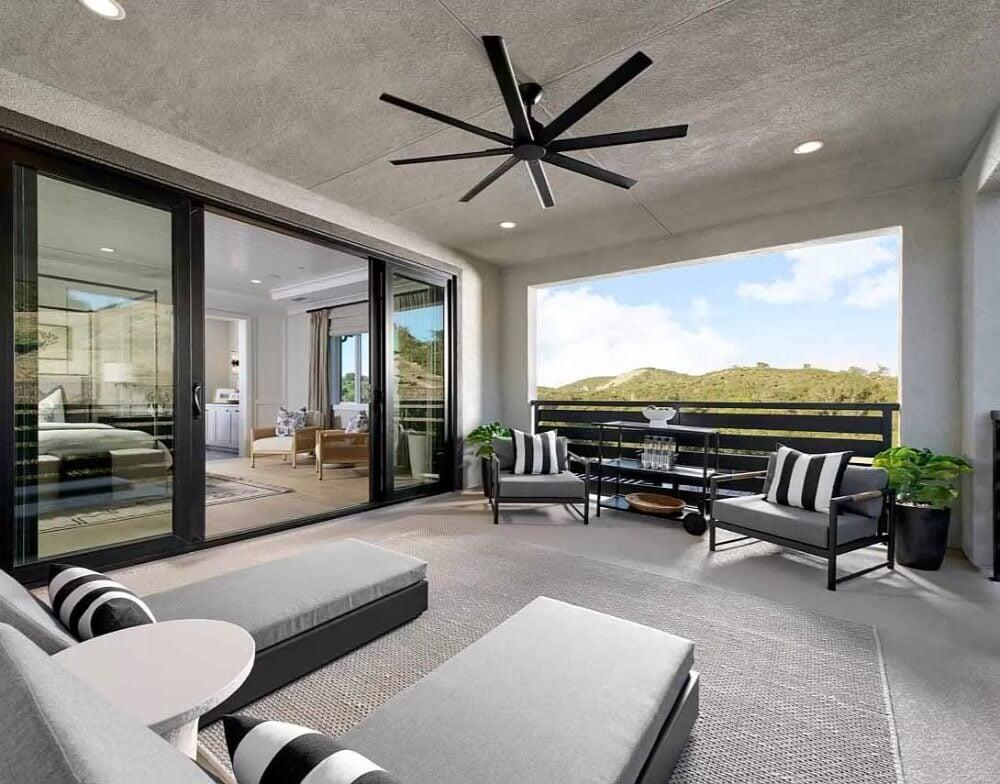 Admire the Sleek Ceiling Fan on This Inviting Covered Patio
