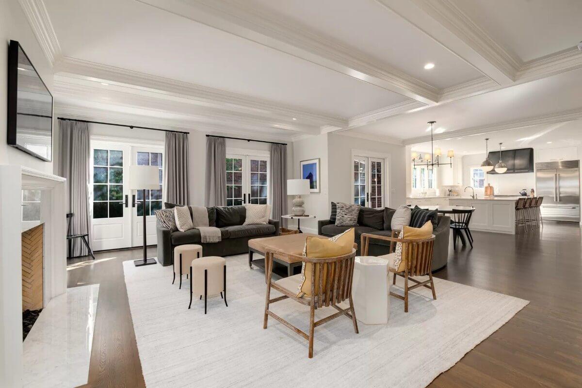 Check Out This Open Living Space With Its Inviting Fireplace and Clever Seating Arrangement