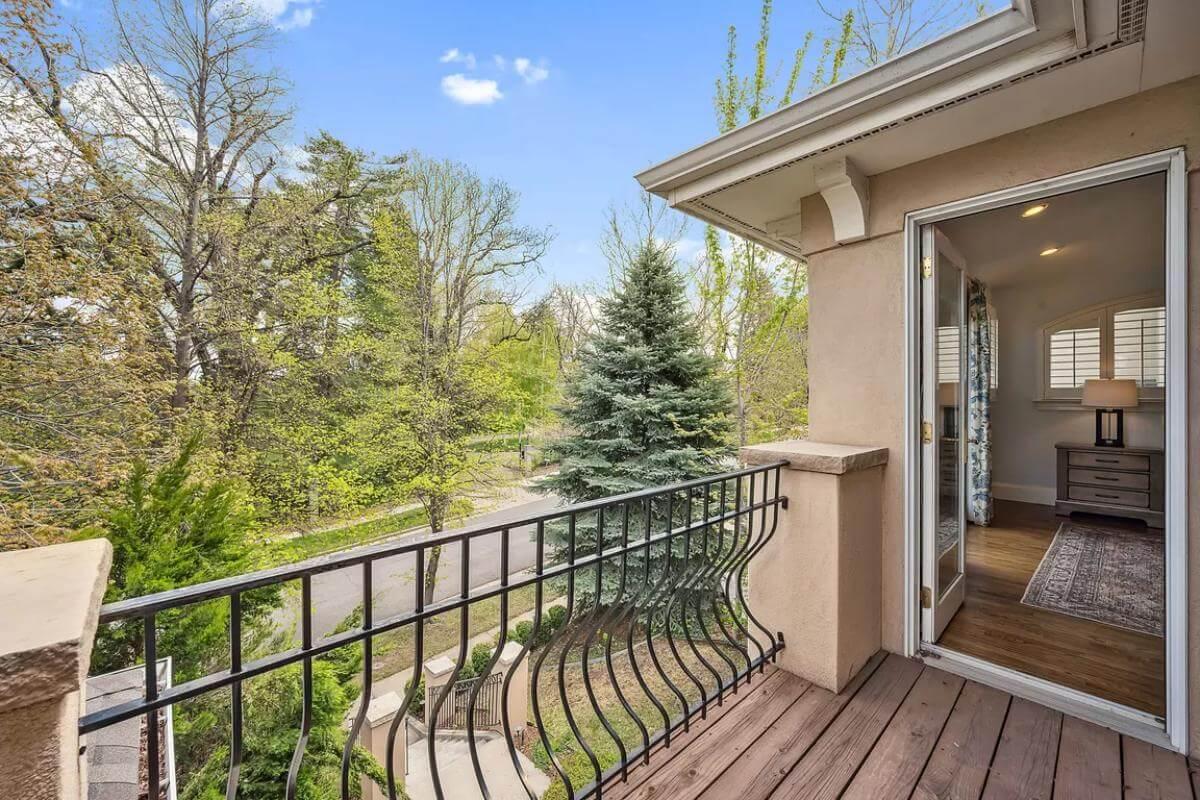 Feel the Breeze on This Charming Balcony with Curved Iron Rails