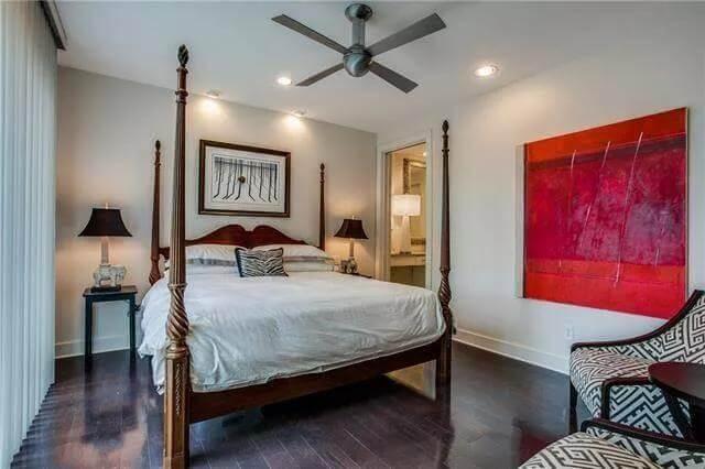 Contemporary Bedroom with Bold Art and a Cozy Four-Poster Bed