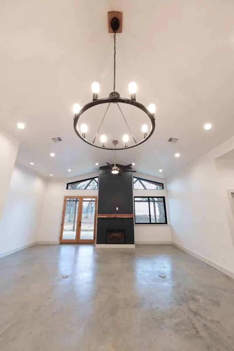Look at the Modern Chandelier in This Simple, Open Space