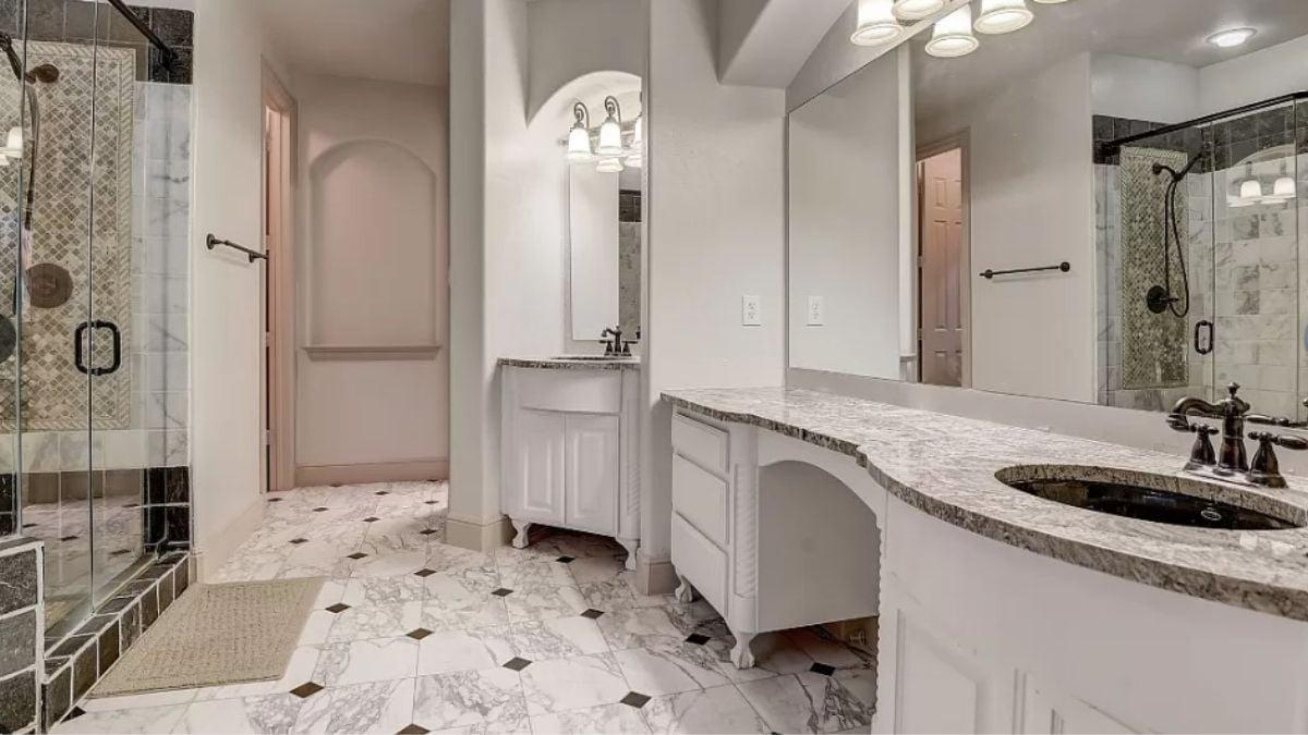 Take a Look at This Intricately Tiled Shower in a Spacious Bathroom