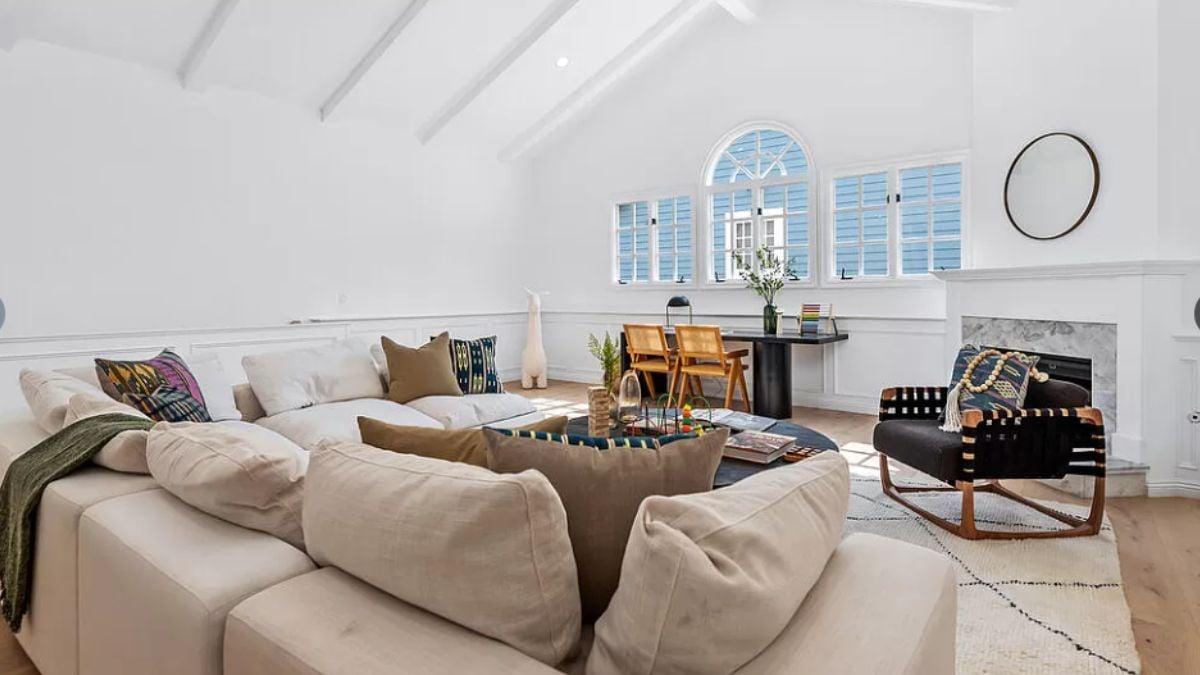 Airy Living Room with Vaulted Ceilings and Mid-Century Flair