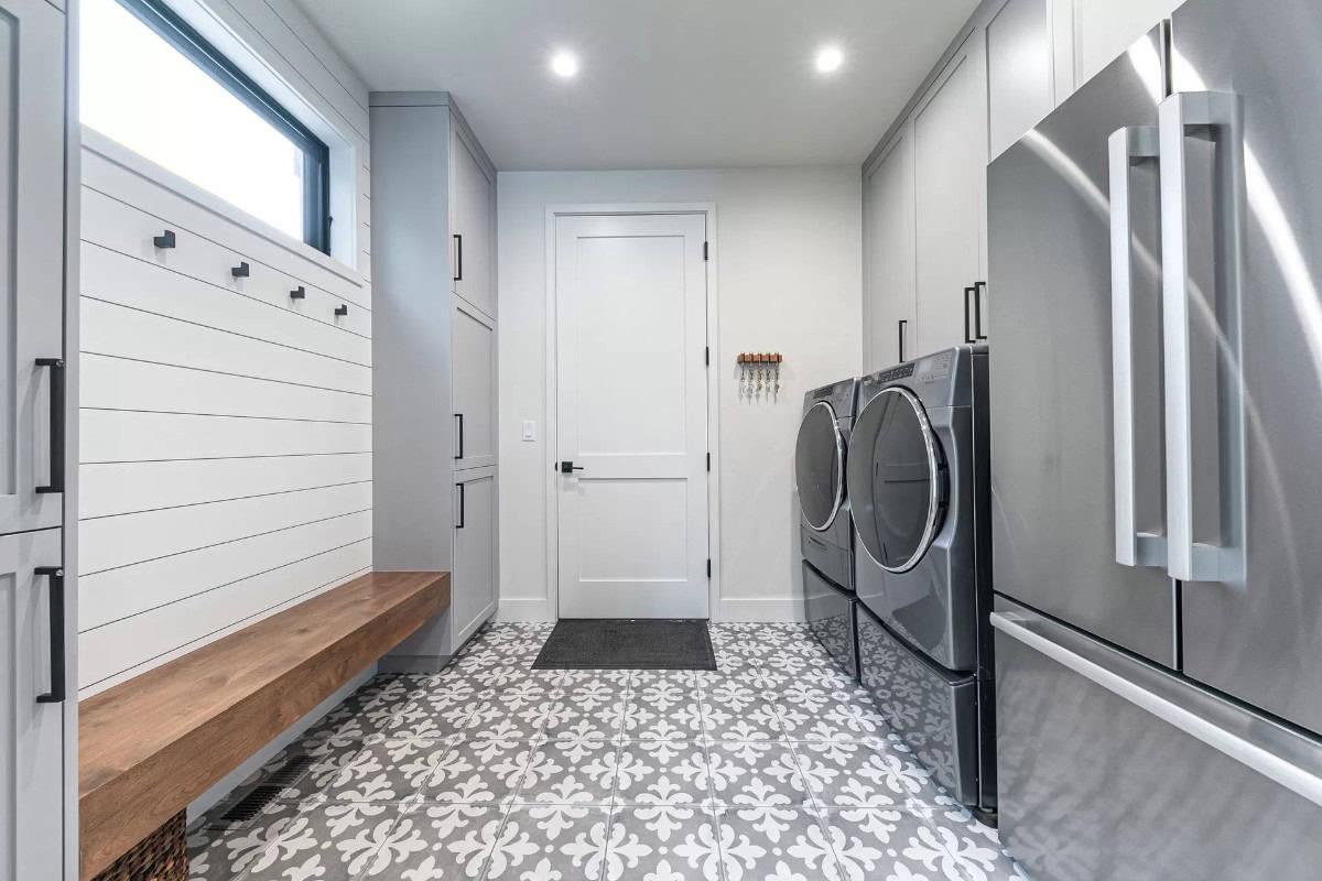 You Have to See These Patterned Floor Tiles in This Practical Laundry Room
