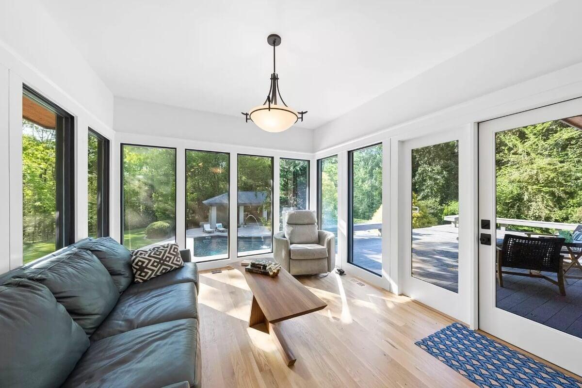Sun-Kissed Sunroom with Expansive Glass Doors