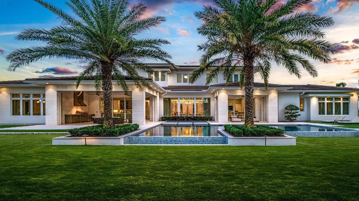 You Have to See This Stunning Pool Area with Lush Palm Trees