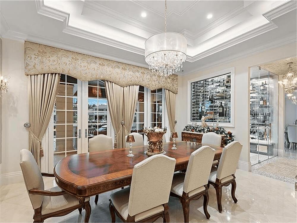 Elegant Dining Room with Floor-to-Ceiling Wine Display Steals the Show