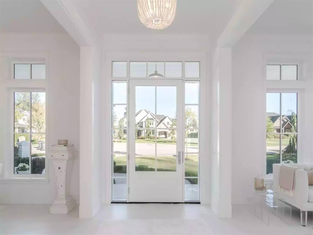 Step Into This Bright Foyer Framed by Transom Windows